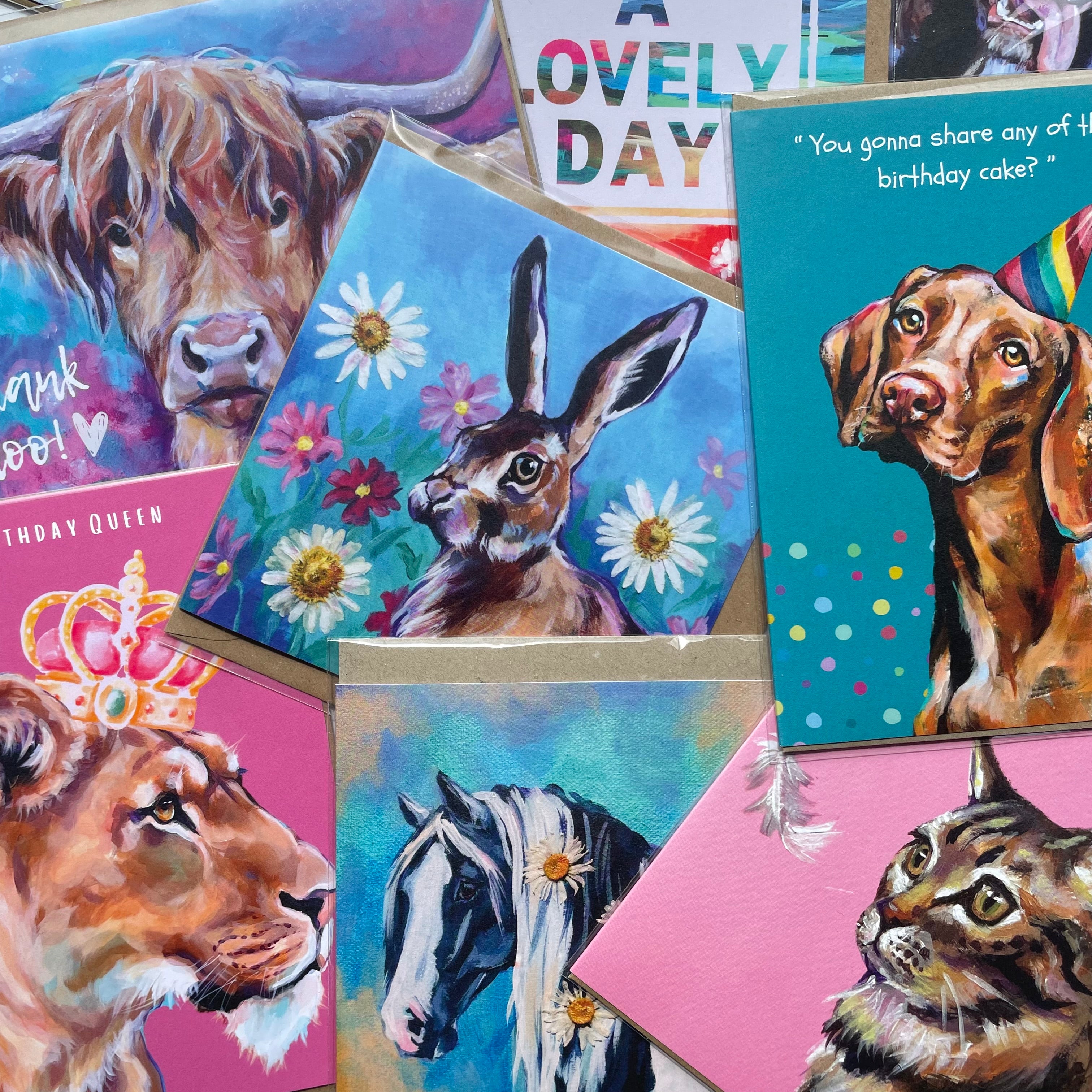 selection of animal art greetings cards by artist Anj Jamieson displayed in a random fashion