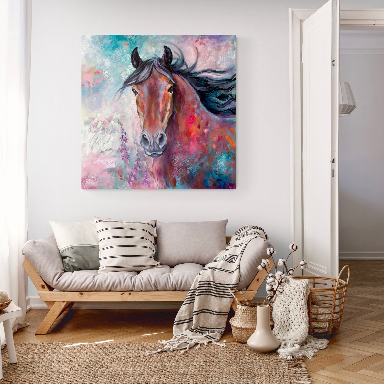 Colourful large horse painting hanging in a cosy living room